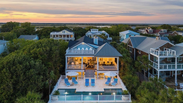A large house with a pool, multiple decks, and a view of the surrounding area. - Beachside Stay With Pool, Two Decks, Rooftop Lounge & Steps to Front Beach IOP Beachhouse by Avantstay (Isle of Palms)