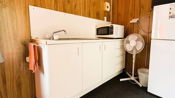 Full-size fridge, microwave, highchair, cookware/dishes/utensils