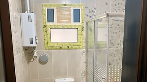 A bathroom with a sink, toilet, and shower. - Elegant Apartment at Sheikh Zayed Compound (Sheikh Zayed City)