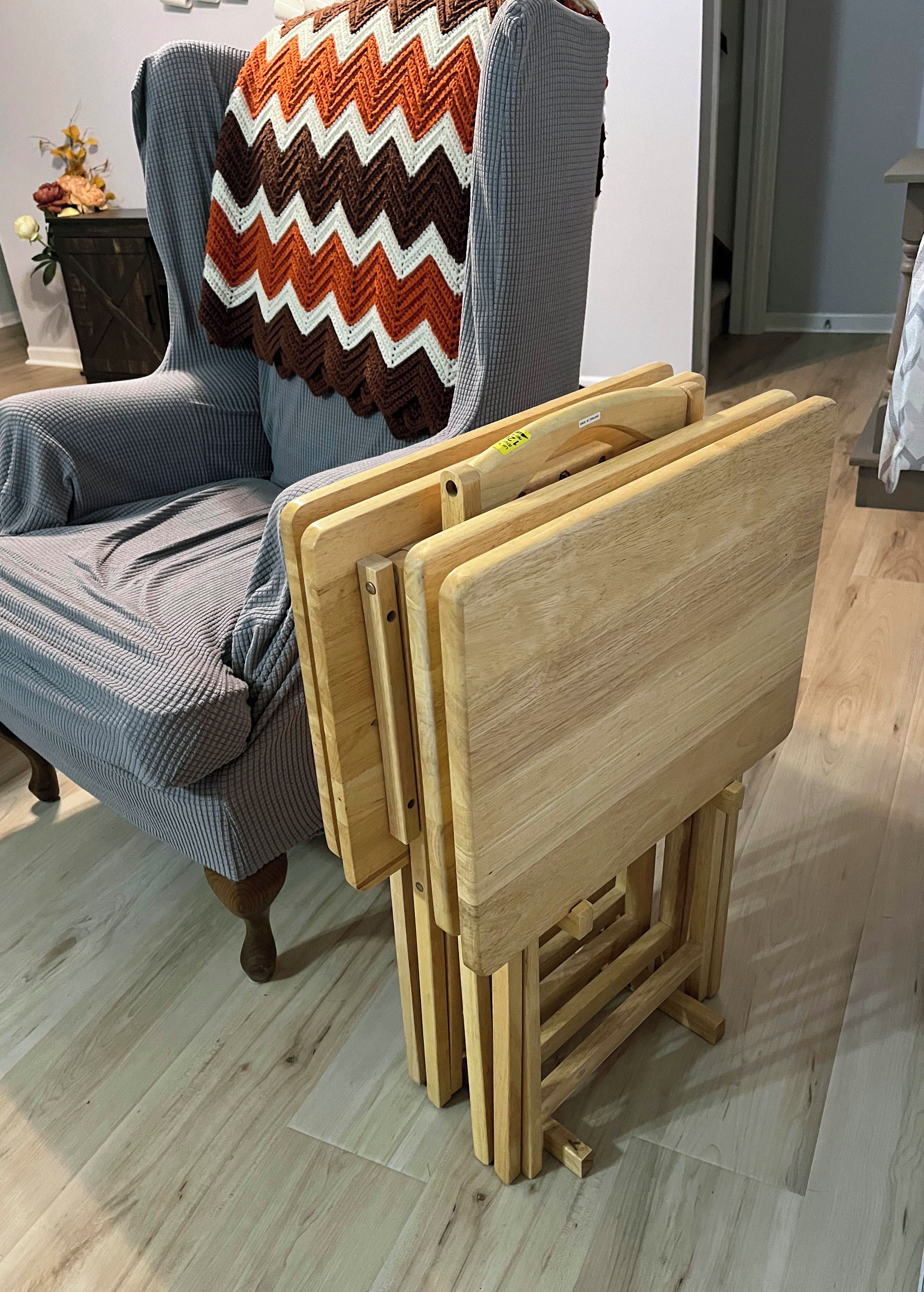 A chair with a wooden frame and a striped fabric seat.