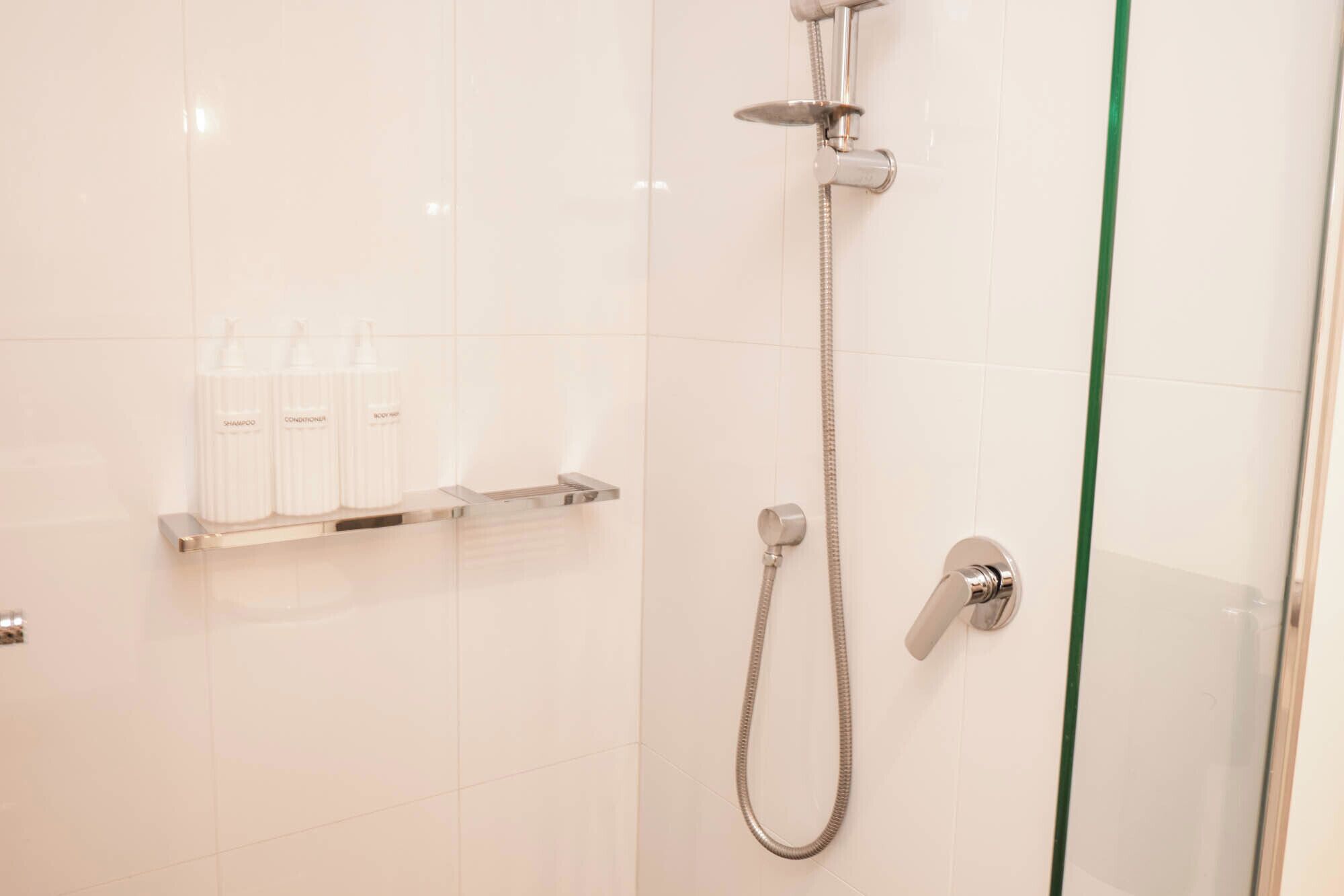 Shower, hair dryer, towels, soap
