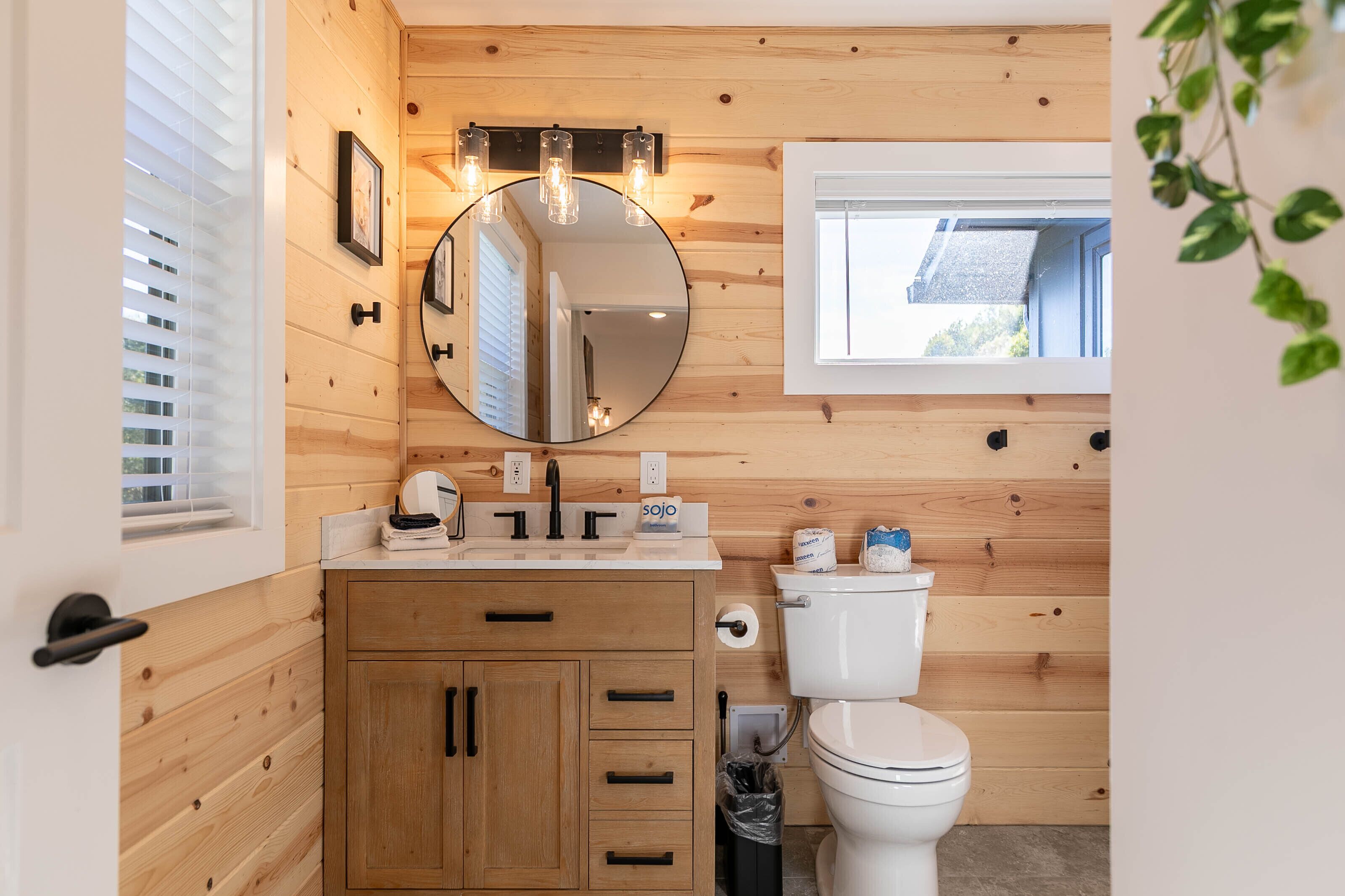Fresh and modern meets mountain charm in this bright bath at Blackberry Hill, wrapped in warm knotty pine.