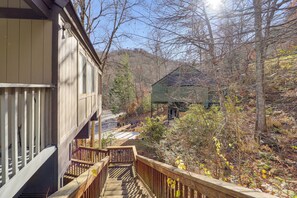A wooden staircase leading to a house with a porch, surrounded by trees and a clear sky. - 1/4 Mi to Golf & Skiing! Sugar Mountain Getaway (Sugar Mountain)