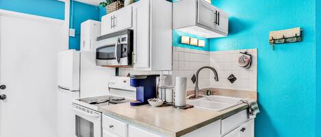 Fridge, microwave, stovetop, coffee/tea maker