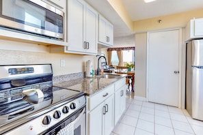 Coffee/tea maker, fridge, microwave, stovetop - Oceanfront Escape with Pool, Balcony & Direct Beach Access (Daytona Beach)