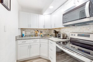 Fridge, microwave, oven, stovetop - Oceanfront Escape w/ Pool, Walk to Eats & Daytona Boardwalk (Daytona Beach Shores)