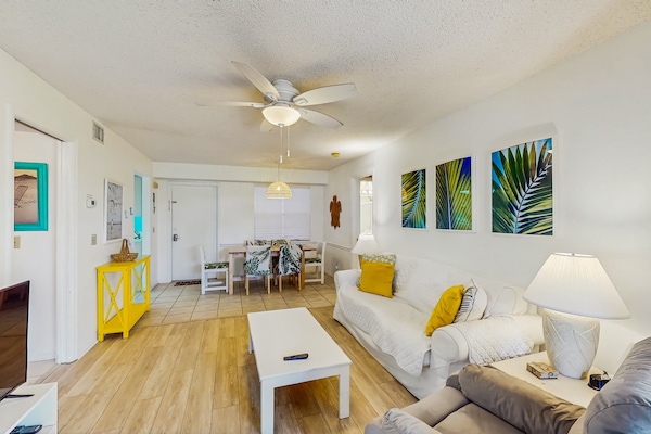 Enjoy a relaxing beach stay in this bright coastal condo featuring tropical décor, open living and dining space, comfy seating, and island-inspired accents—perfect for unwinding after a day in the sun and sand.