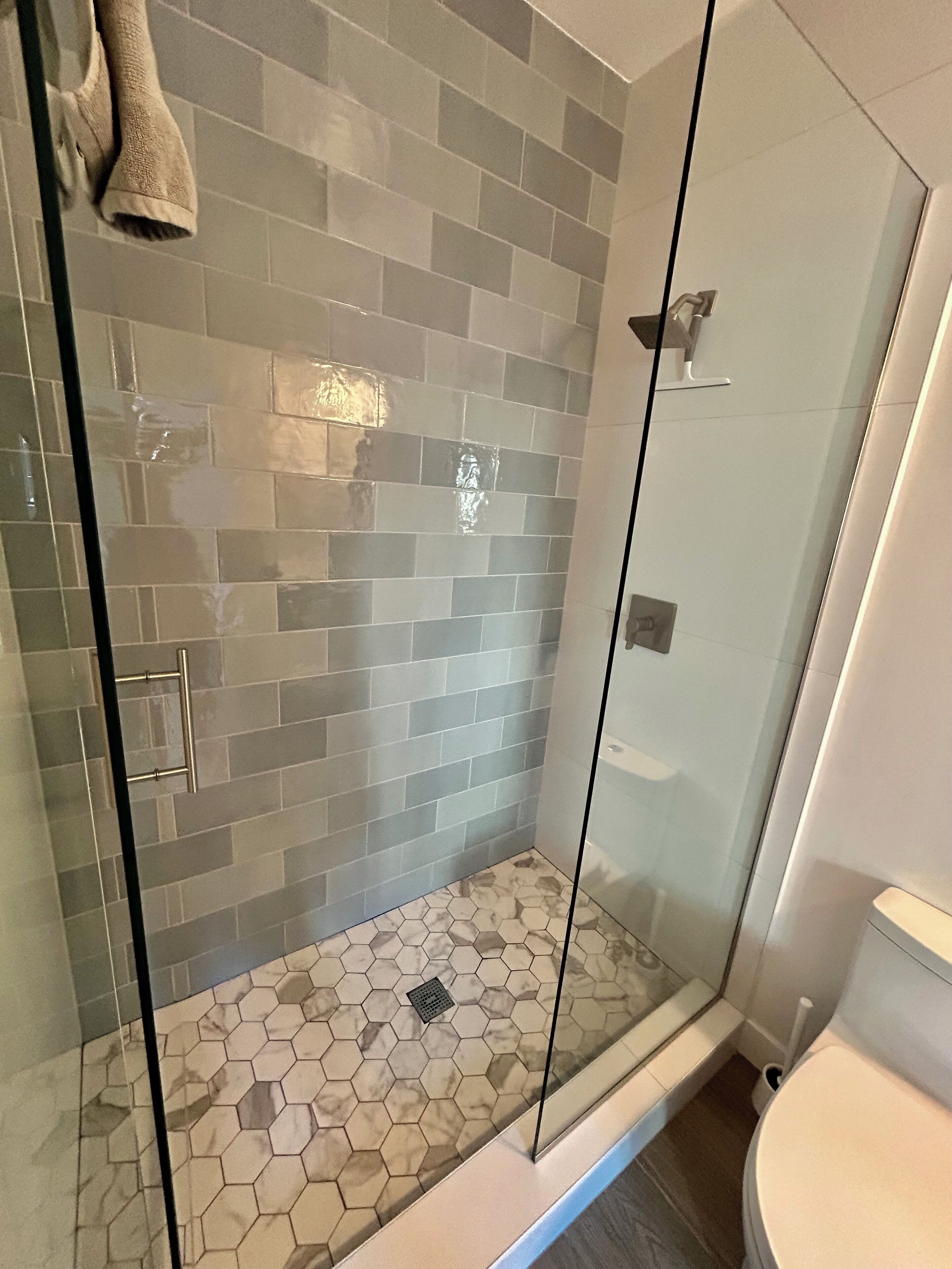 Shower, towels, soap, toilet paper