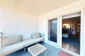 Outdoor dining - Modern Coastal Condo w/ Balcony, Pool & Easy Walk to the Beach (New Smyrna Beach)