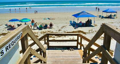 Modern Coastal Condo w/ Balcony, Pool & Easy Walk to the Beach