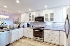 Fridge, microwave, oven, stovetop - Modern Coastal Condo w/ Balcony, Pool & Easy Walk to the Beach (New Smyrna Beach)