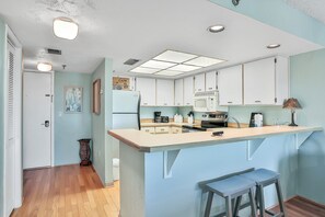 Fridge, microwave, oven, stovetop - Oceanfront escape w/ 2 balconies & pool access – peaceful beach vibes (Ormond Beach)