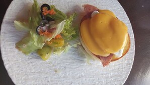 A plate with a sandwich and a side salad. -  Beach  just a few steps away, offering easy access to the island’s attractions. (Preah Sihanouk)