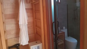 A wooden room with a shower, a toilet, and a small cabinet. -  Beach  just a few steps away, offering easy access to the island’s attractions. (Preah Sihanouk)