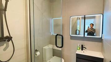 Shower, hair dryer, towels, soap