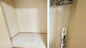 A room with a wooden floor, a white wall, and a white chair. - YMK Oshiage 7A (Tokyo)