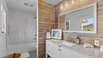 Shower, jetted bath, towels, soap