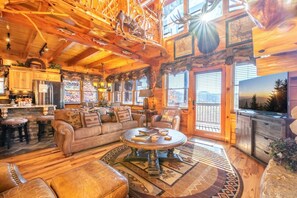 TV, fireplace - Unrivaled - Treehouse-Style Interior with Spa Bath, Hot Tub, Theater & Firepit (Sevierville)