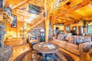 TV, fireplace - Unrivaled - Treehouse-Style Interior with Spa Bath, Hot Tub, Theater & Firepit (Sevierville)