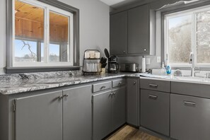 Fridge, microwave, oven, stovetop - Charming & Cozy Waterfront Cabin at 21mm Near Shorty Pants (Osage Beach)