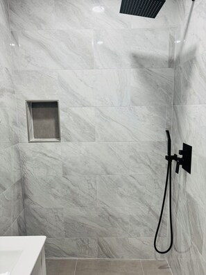 Shower, hair dryer, towels, toilet paper