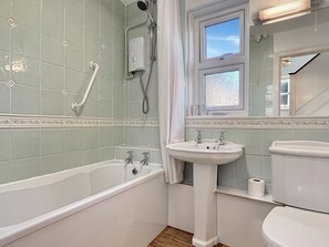 A bathroom with a bathtub, sink, and toilet. - Oxford House, Porlock (Porlock)