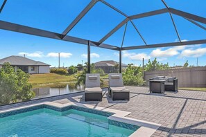 Outdoor pool, a heated pool - Coral Waters Modern Escape: Pool Home (Cape Coral)