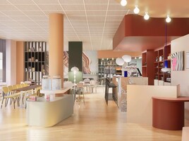Un interior moderno con mostrador de recepción, zona de estar y detalles decorativos.
