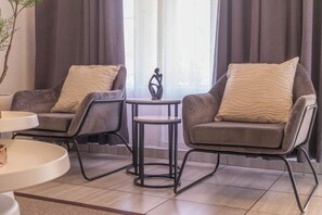 Apartamento conforto, varanda, vista para o jardim | Área de estar