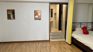 Apartment, City View, Mezzanine | Bathroom | Hair dryer, slippers, towels, soap