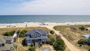 A coastal property with a large house, a swimming pool, and a beach view. - Ocean front oasis full remodel hot tub heated pool Wild horses 8 bed 8 bath (Corolla)
