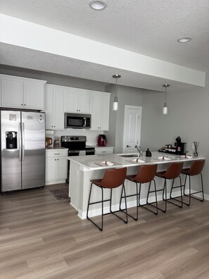 Fridge, microwave, oven, stovetop - New, spacious, 3 bedroom 2.5 bath townhome in a peaceful Urbandale, IA! (Urbandale)