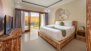 A bedroom with a large bed, a TV, and a view of a swimming pool. - Cove Cubang Homestay (Kutuh)