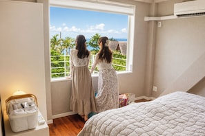 A bedroom with a large window, a bed, and a suitcase. - A Premium Okinawa Villa Stay with Sauna & Jacuzzi (nakama, Onna Village)
