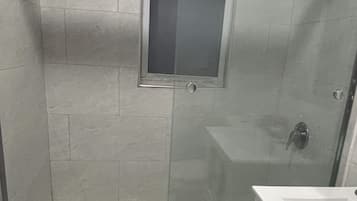 Shower, towels, soap, shampoo