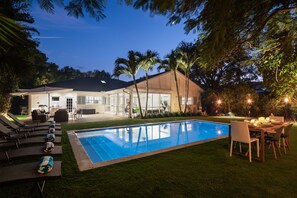 Outdoor pool, a heated pool - Olde Naples Beach House. Newly renovated, walk to beach and Four Seasons Resort (Naples)