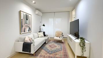 Classic Apartment | Living area | 55-inch Smart TV with cable channels, Netflix, streaming services