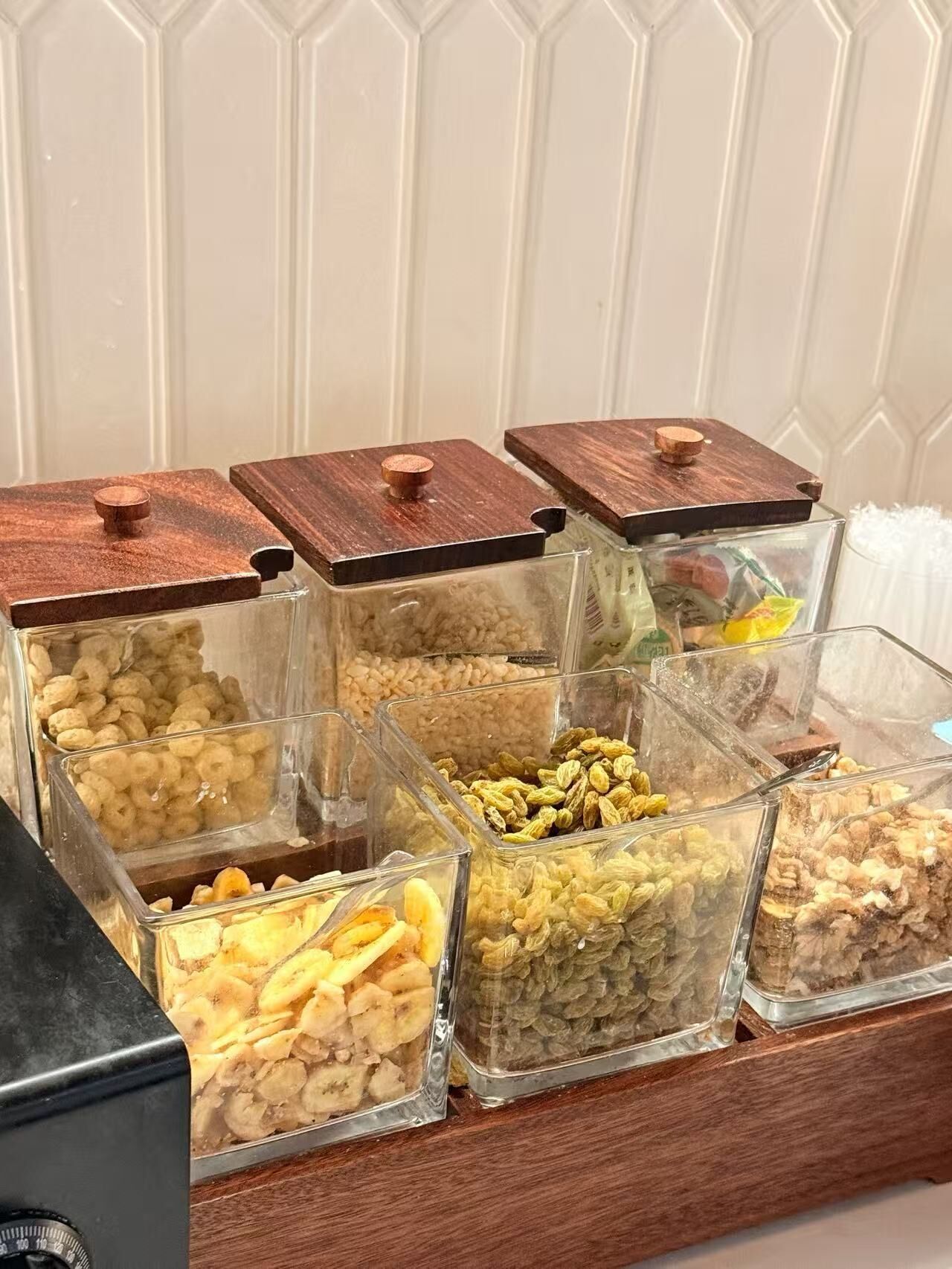 A storage unit with multiple compartments containing various food items.