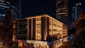 A modern hotel with multiple floors, a well-lit facade, and signage indicating it is a CYBC hotel. - CYBO Junting Shangpin Hotel (Chengdu Chunxi Road Tianfu Square Branch) (Chengdu)