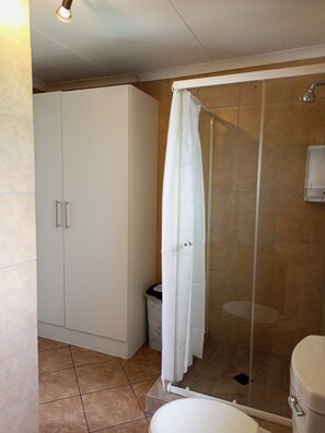 Shower, towels, soap, toilet paper