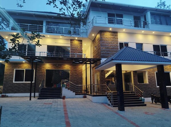 A multi-story building with a covered entrance, a staircase, and a balcony. - BKP Jungle Resorts (Yercaud)