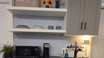 Fridge, microwave, coffee/tea maker, toaster