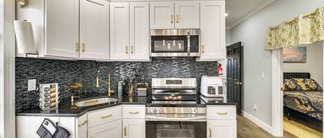 Fridge, microwave, stovetop, coffee/tea maker