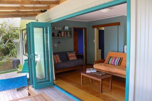 Books, computer monitors - Classic Kiwi Bach – Moureeses Bay (Whananaki)