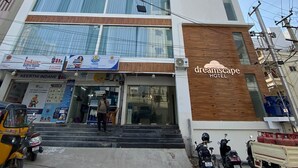A multi-story hotel with a modern design, featuring a prominent sign for Dreamscape Hotel. - Dreamscape Hotel by Fracspace  OU Colony (Hyderabad)