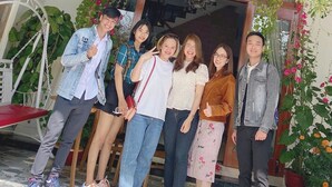 A group of people standing in front of a building with a sign that reads "Homestay An Tuong." - Hoi An Impression Homestay (Hoi An)