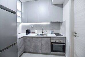 Fridge, oven, stovetop, coffee/tea maker - Elegant One-Bedroom Suite • New Building • Prime Location (Skopje)