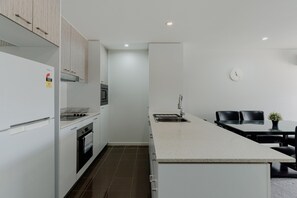 Fridge, microwave, oven, stovetop - Urban 1-Bed Apartment in the Heart of the City (Braddon)