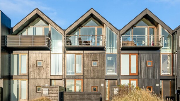 A modern multi-story building with large windows and balconies. - "Saxi" - 650m from the sea by Interhome (Skagen)
