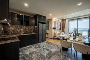 Family Suite, 3 Bedrooms, Club Lounge Access, City View | Private kitchen | Full-size fridge, microwave, oven, stovetop - Zenith Luxstay Lumiere Riverside (An Khanh)